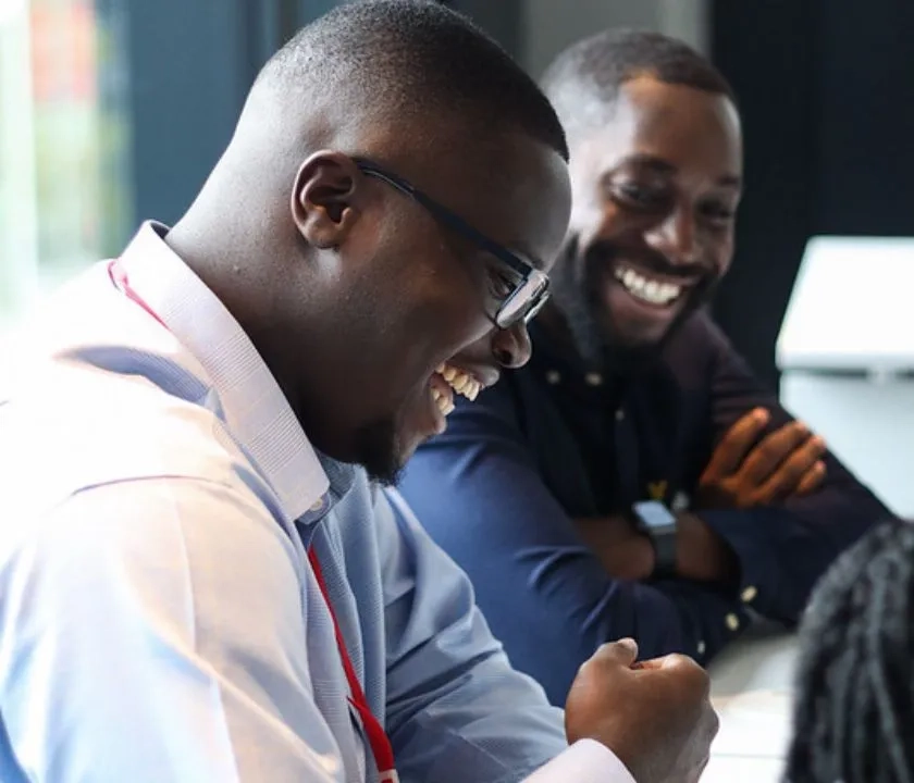 2 students laughing